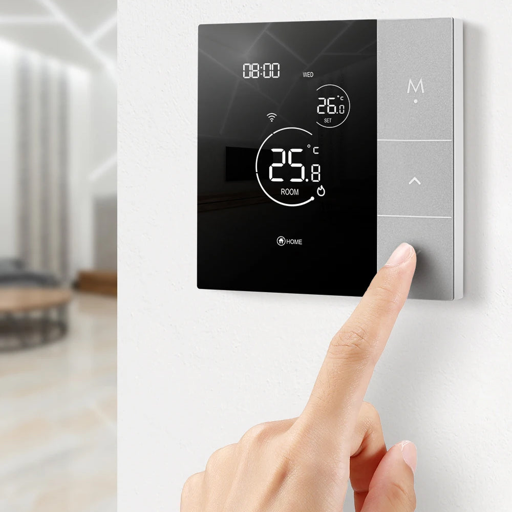 Digital ClimaClik Home Thermostat on a wall with a hand adjusting the settings