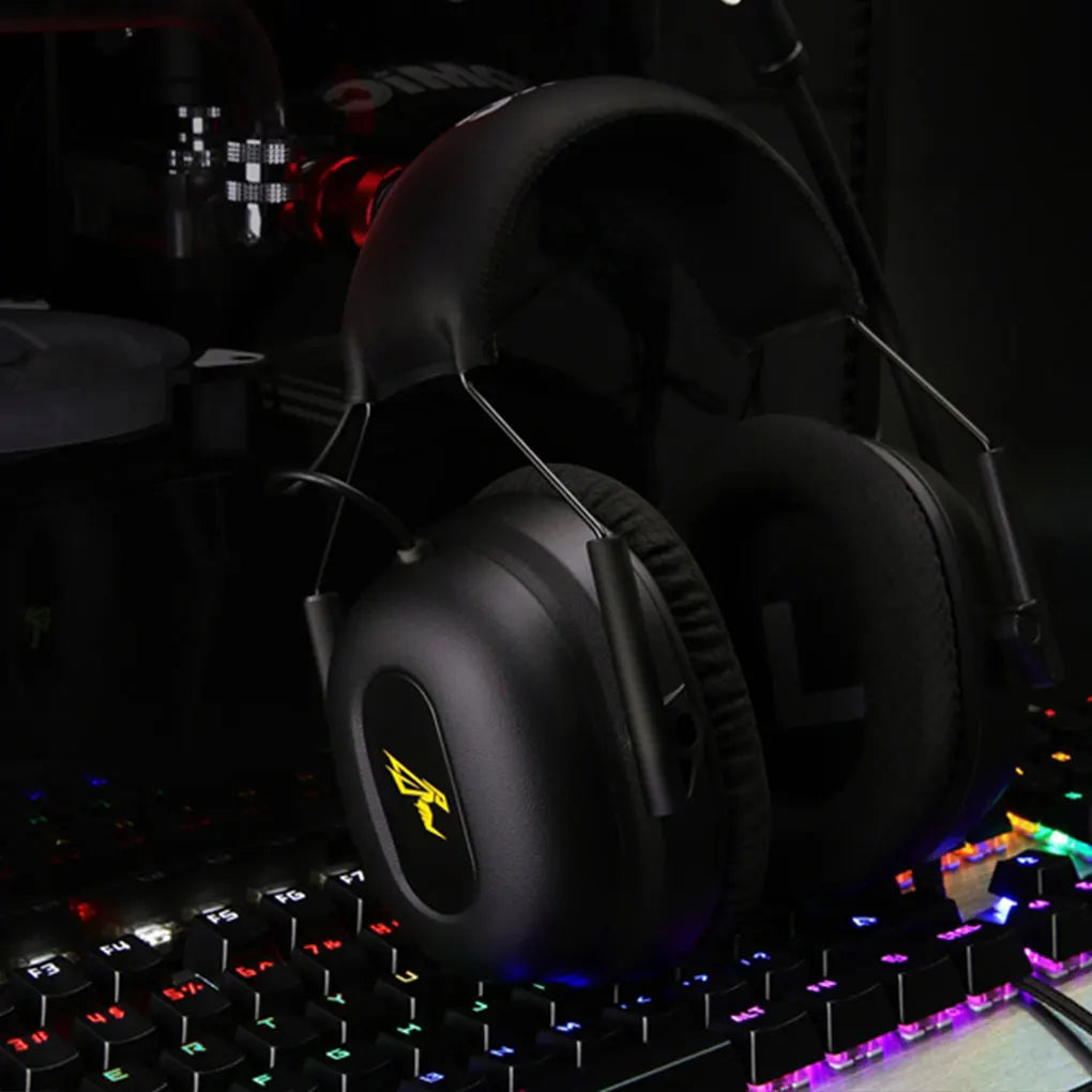 Black Commander G Series Gaming Headphones with a logo on a keyboard with colorful backlighting
