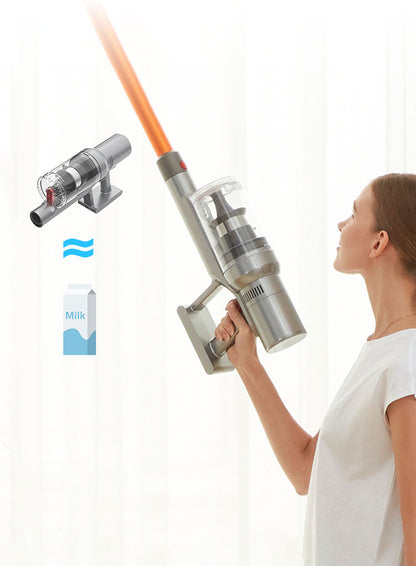 Person holding a modern Drexen Vacuum Cleaner with attachments on a white background