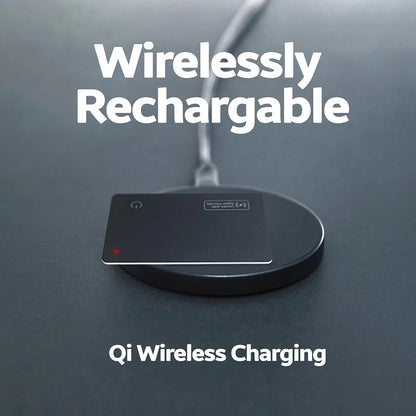 Qi wireless charging pad on a dark surface with 'Wirelessly Rechargable' text.