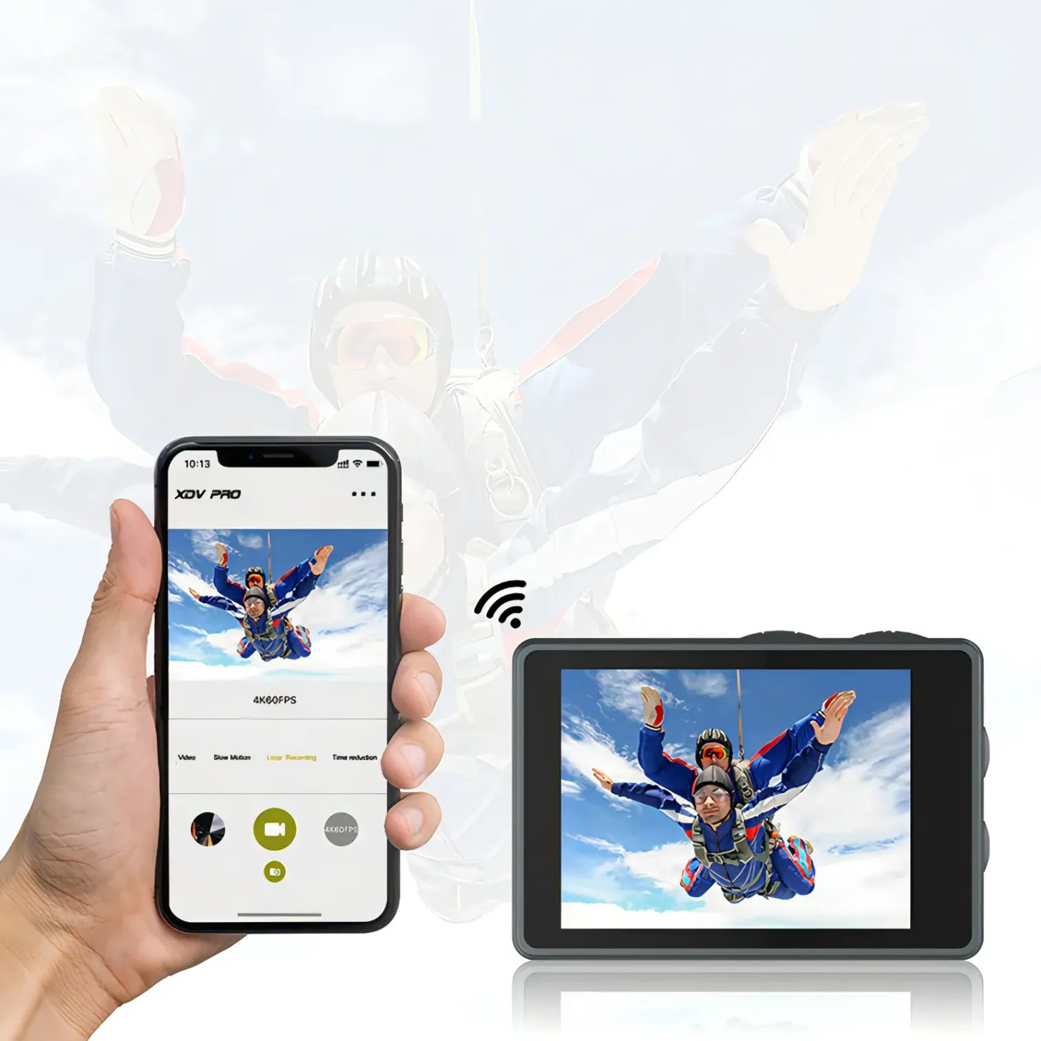 Hand holding a smartphone with a skydiving app and a small Kozenix Action Camera displaying a skydiving video.
