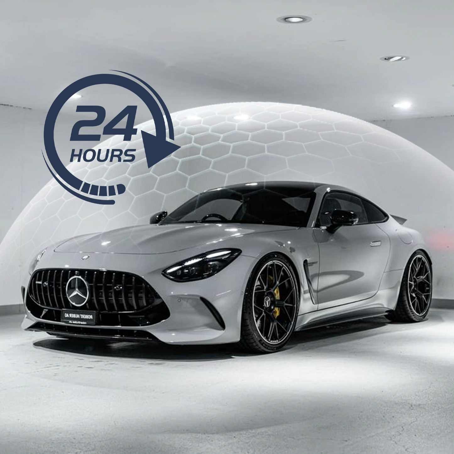White Mercedes-Benz car in a showroom with a '24 Hours' logo.
