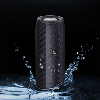 Black Meacode Portable Bluetooth Speaker with water droplets on a dark background