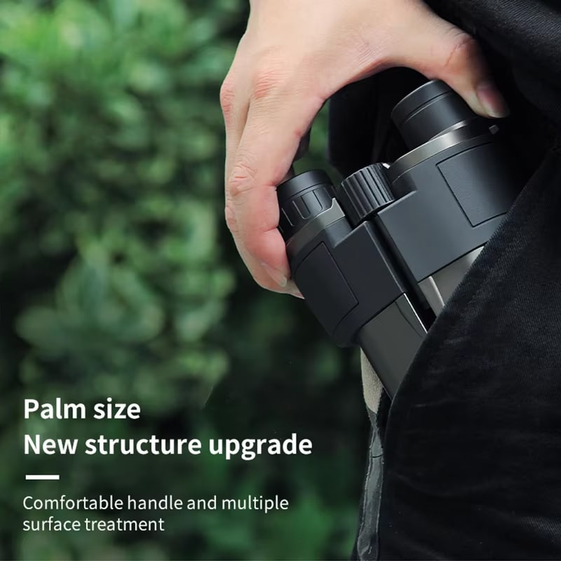 Person holding a palm-sized MikoSpek Binoculars with text about new structure upgrade