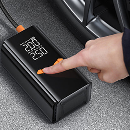 Digital Moxier 2 in 1 Tyre Inflator Jump Starter with a hand pressing a button inside a car.