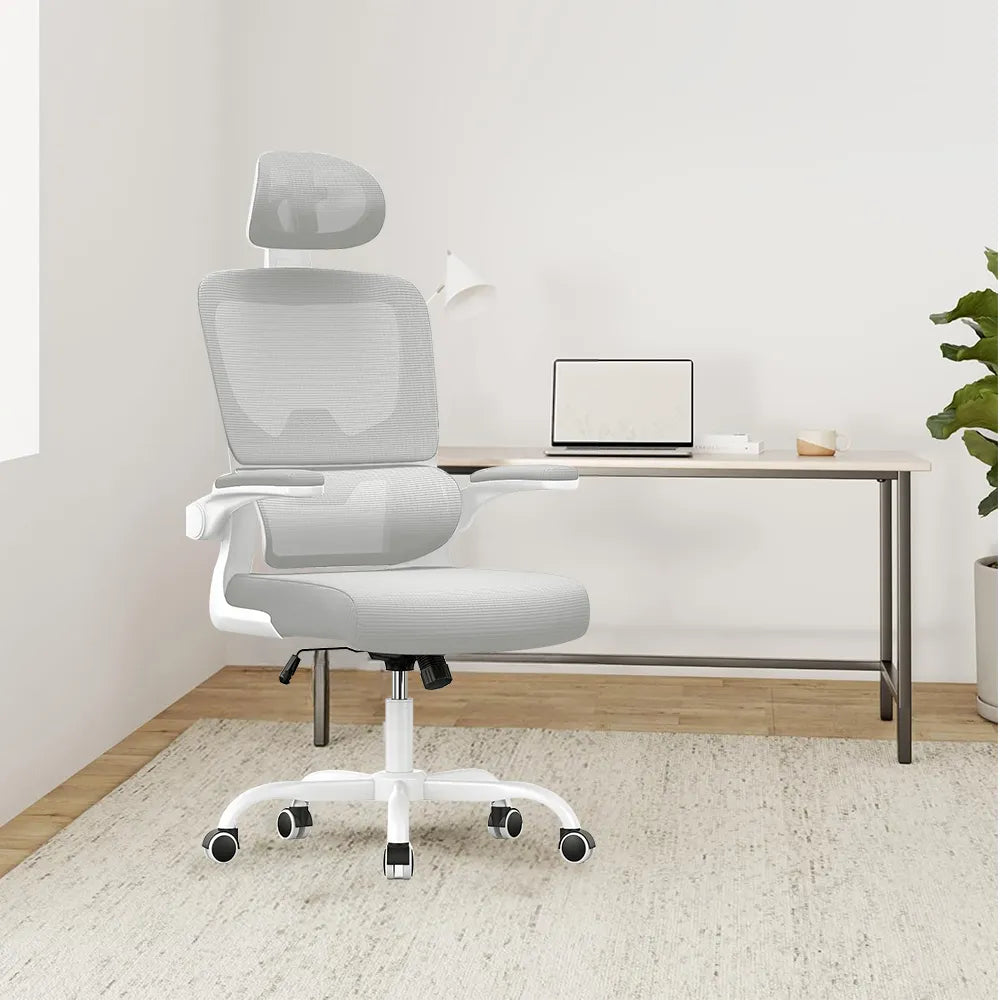 White Ocanvas Ergonomic Office Chair in a minimalistic room with a desk and laptop.