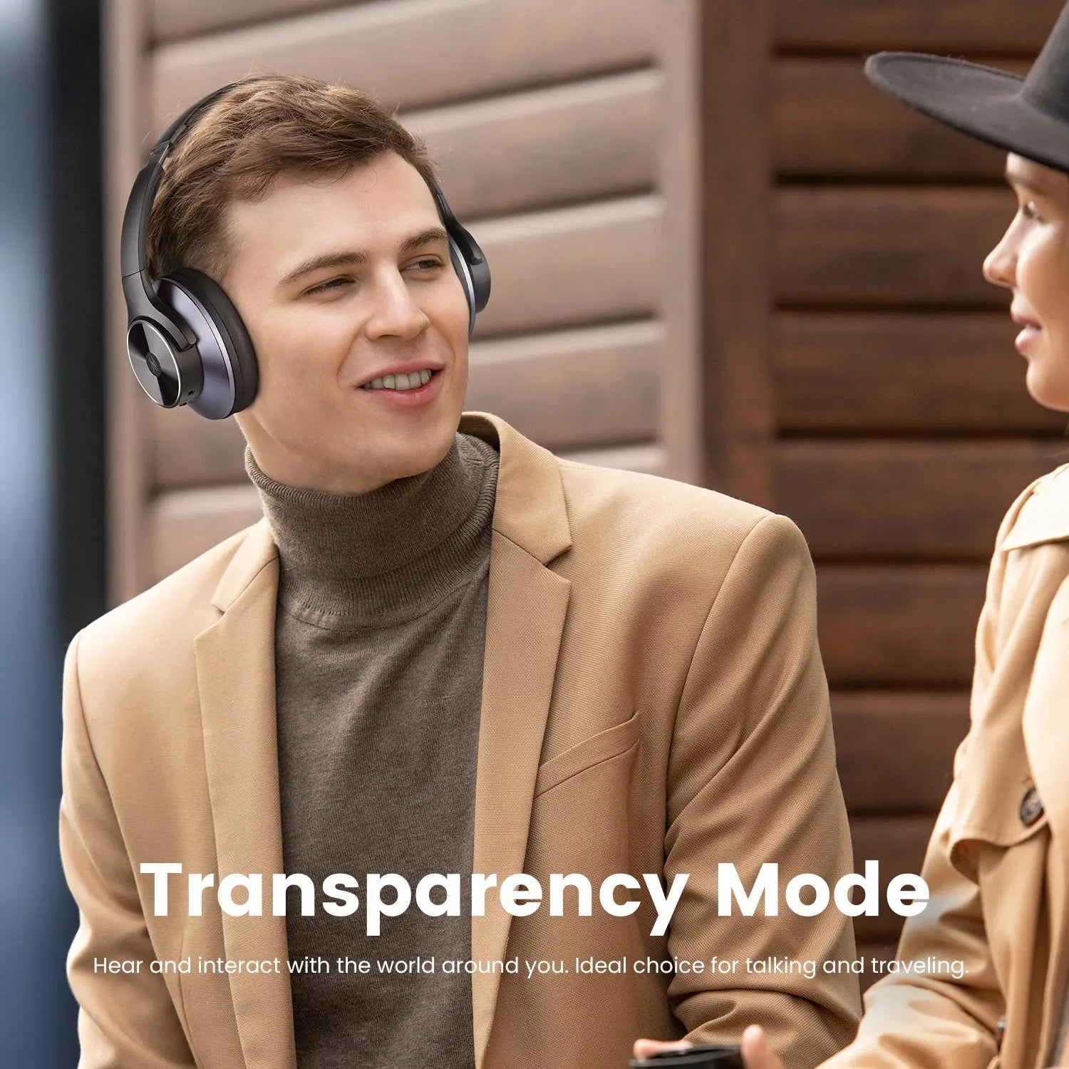 Two people wearing Oneodio A Series Headphones with text 'Transparency Mode' on a wooden background