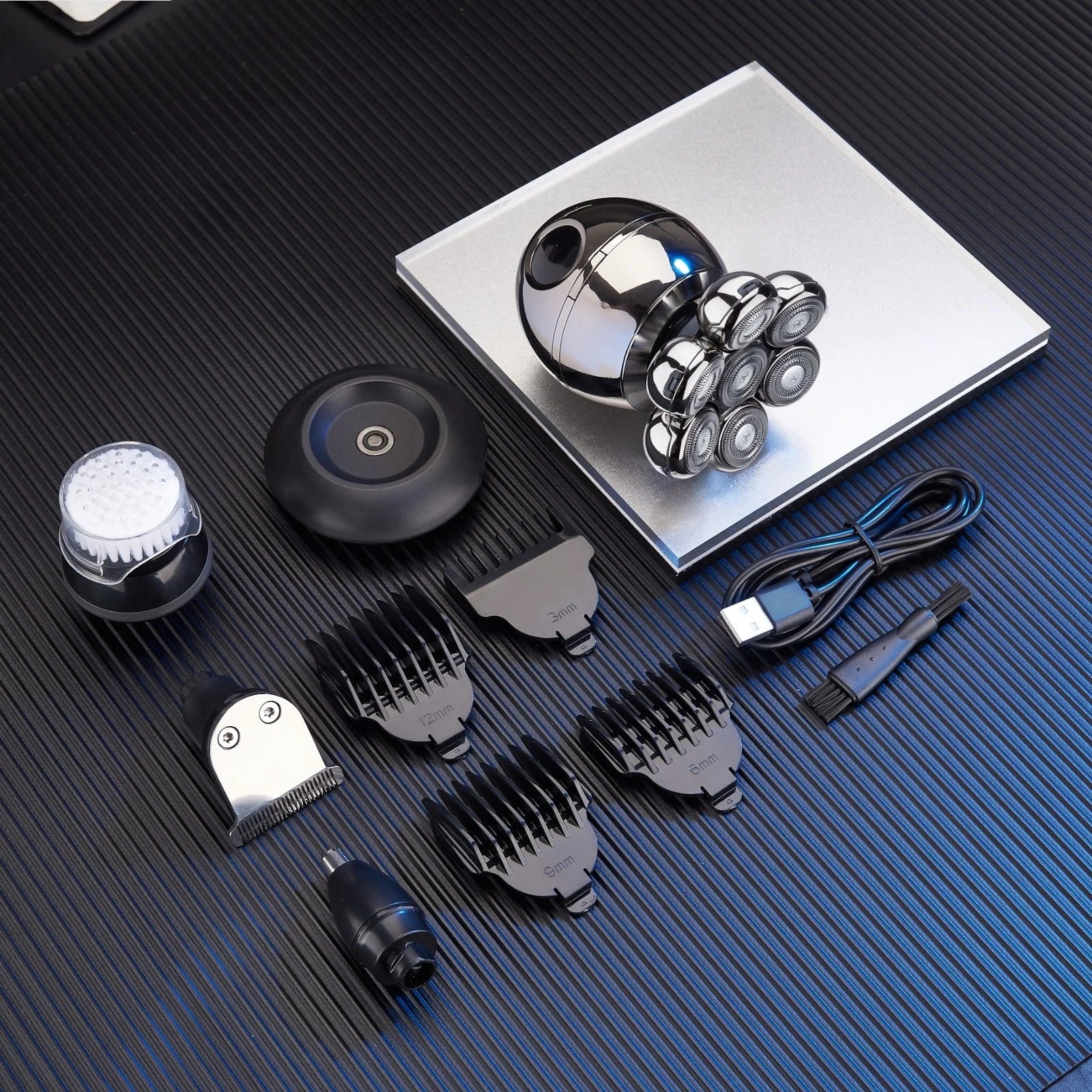 Grooming kit with multiple attachments on a textured surface