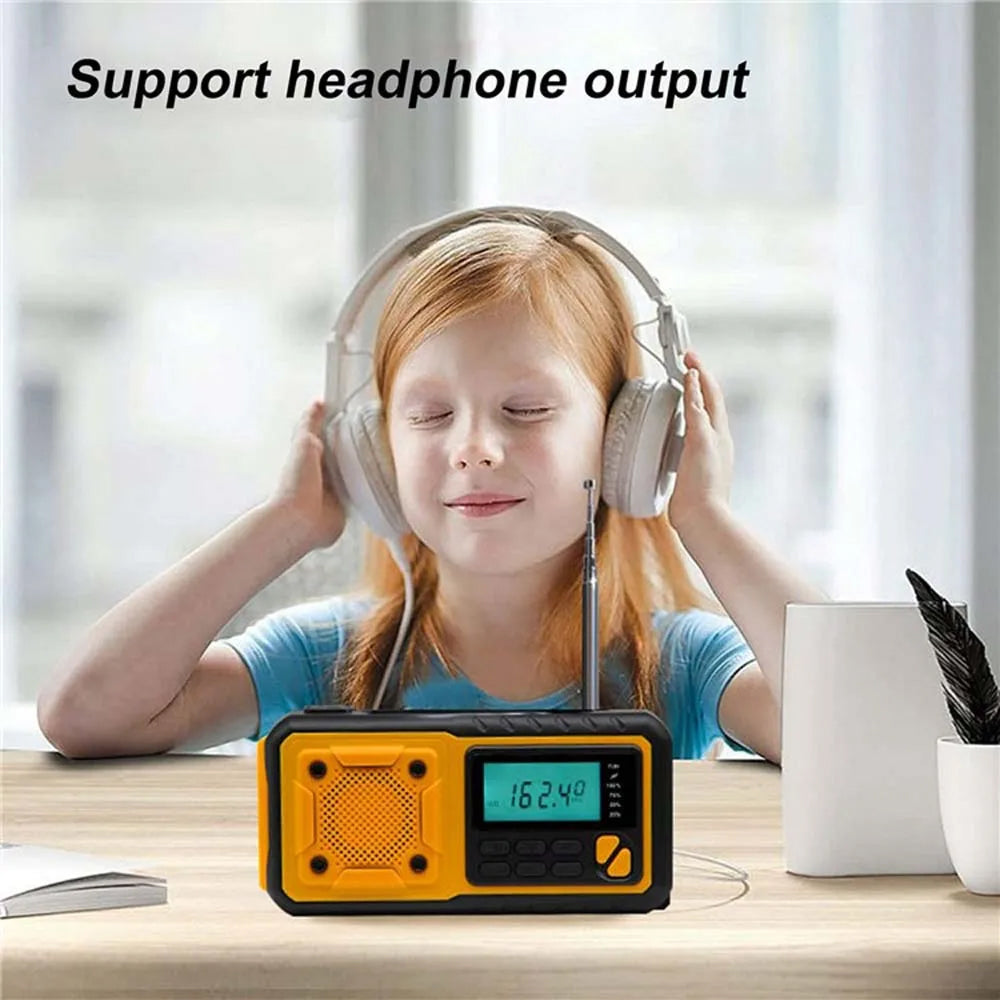 Child SafeNetto Emergency Radio listening to a portable radio with digital display on a table.