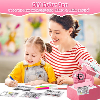 Woman and child using a DIY color pen to decorate black and white photos, with a pink SnapoKidy Instant Camera-like device.