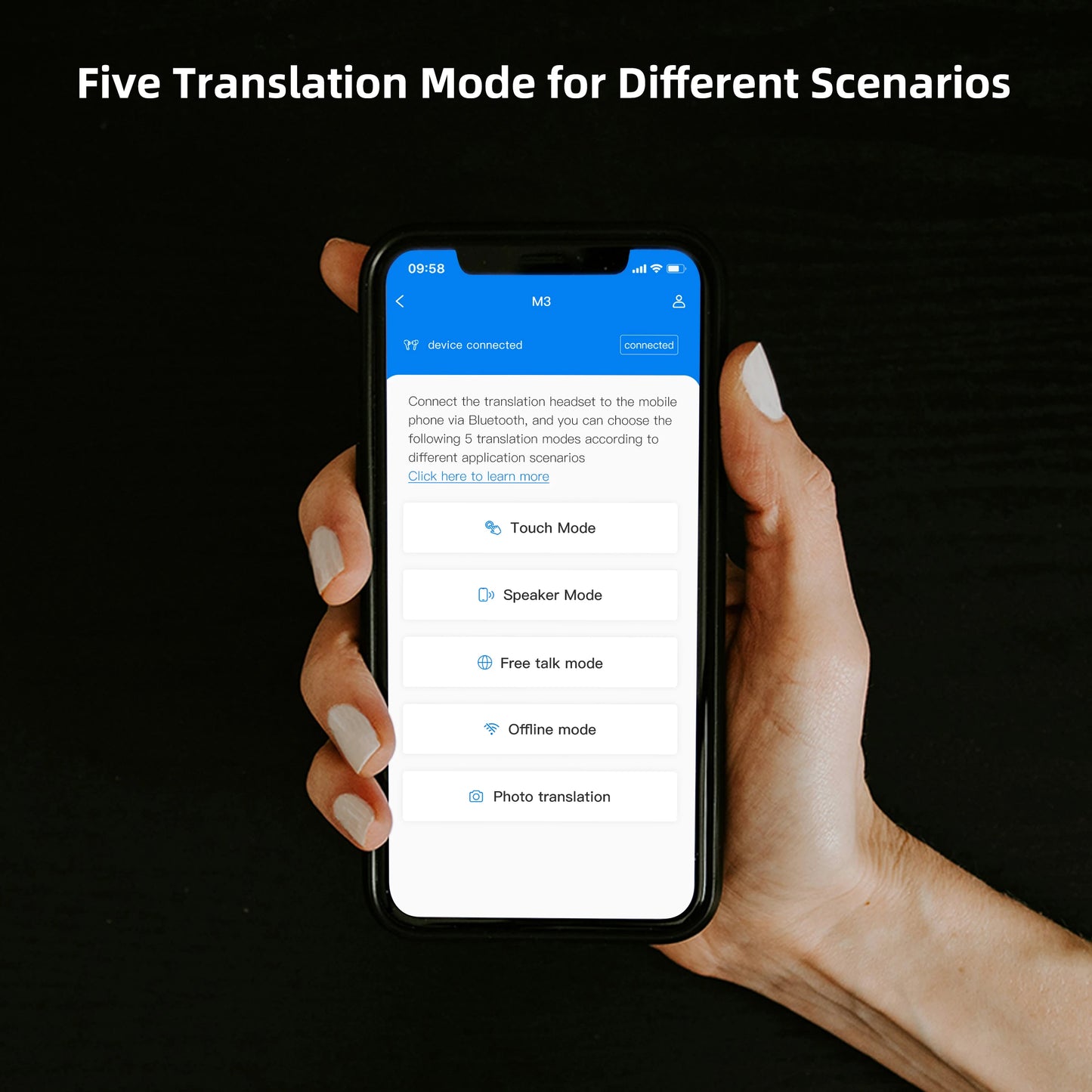 Hand holding a smartphone displaying translation mode options on a black background