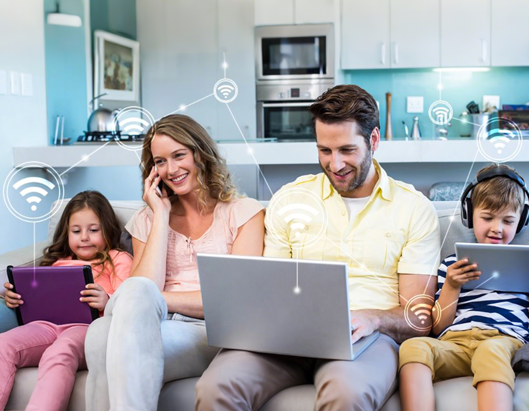 Family using technology in a modern kitchen