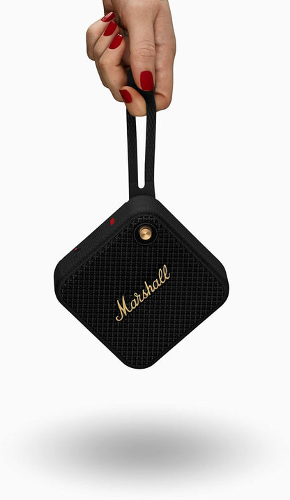 Marshall Willen portable speaker in outdoor setting – waterproof, durable design perfect for travel and adventures