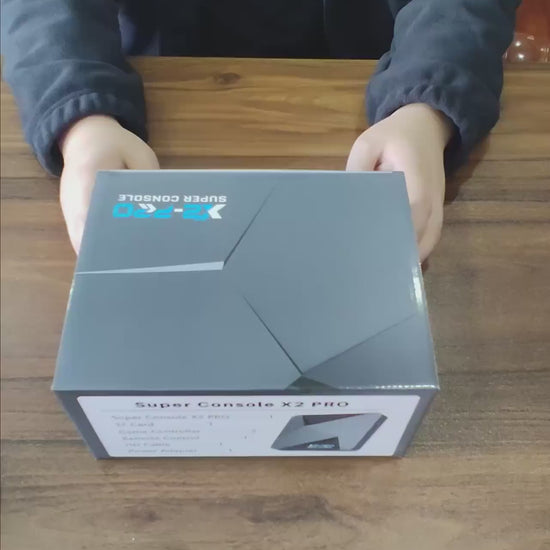 Unboxing the KINHANK X2 Pro Retro Gaming Console and connecting it to a monitor via HDMI, showing dual system boot into EmuELEC and Android TV
