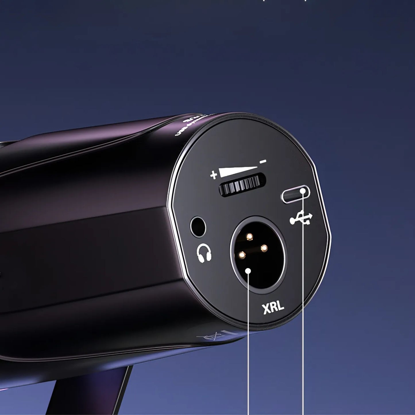 Close-up of a black puruxe microphone with labeled ports on a dark blue background