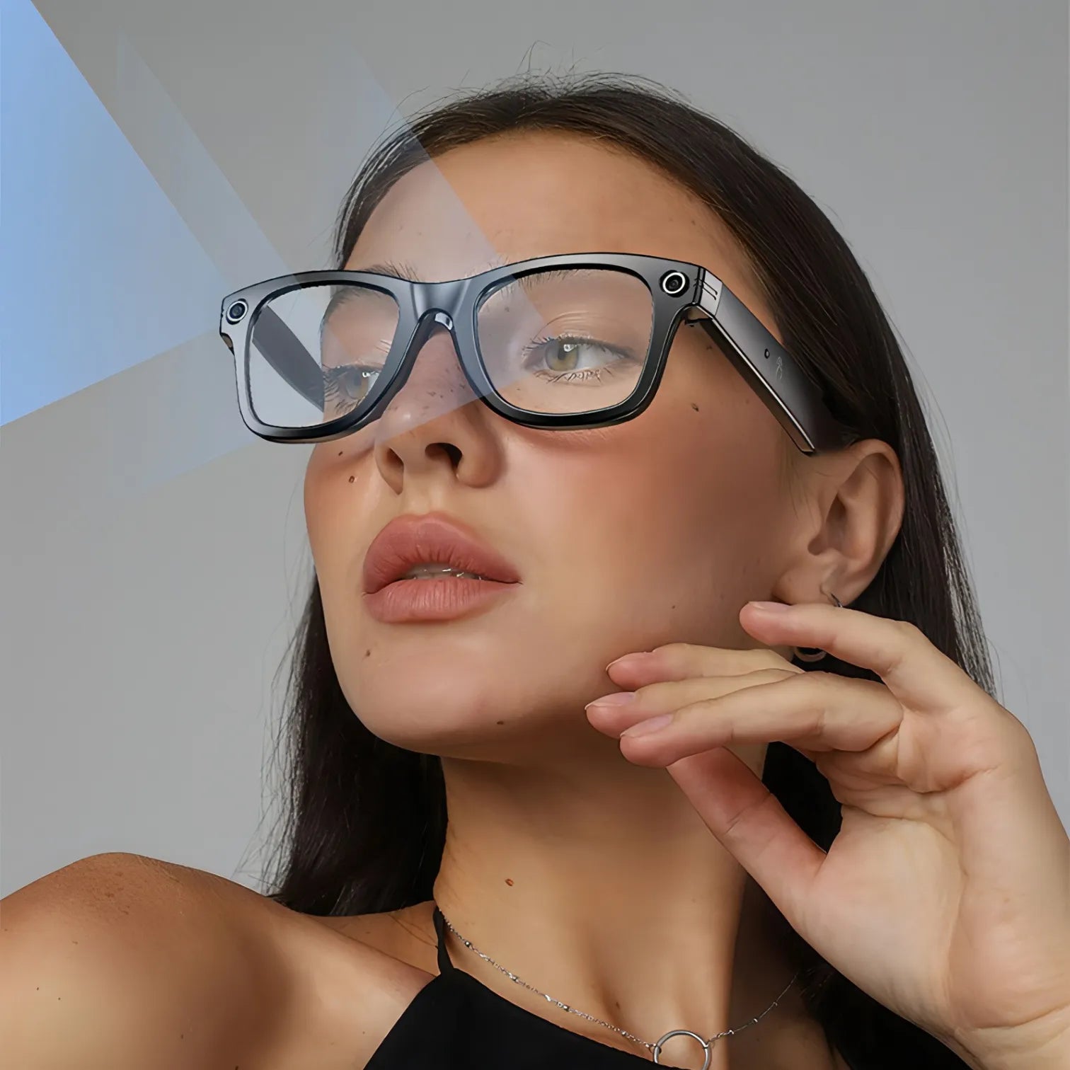 Woman wearing futuristic Trovoro Smart Glasses with a plain background