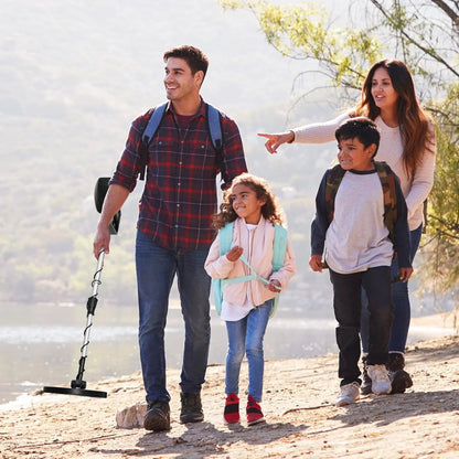 Family of four walking outdoors by a lake with a HunTonnix Metal Detector.