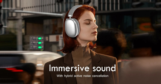 Woman wearing Luvant Noise Cancelling Headphones with 'Immersive sound' text in a blurred urban setting